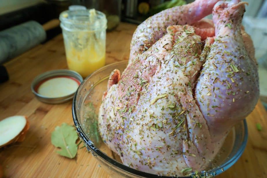 whole chicken covered in herbs