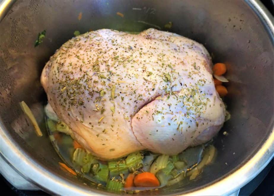 whole chicken covered in herb in instant pot