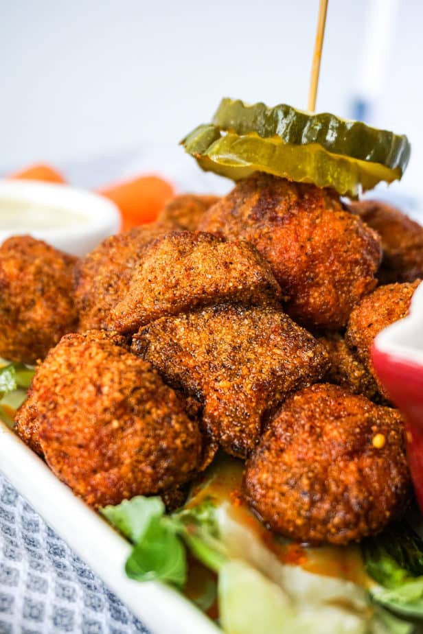 Nashville Hot Cauliflower Wings with pickles ranch and carrots