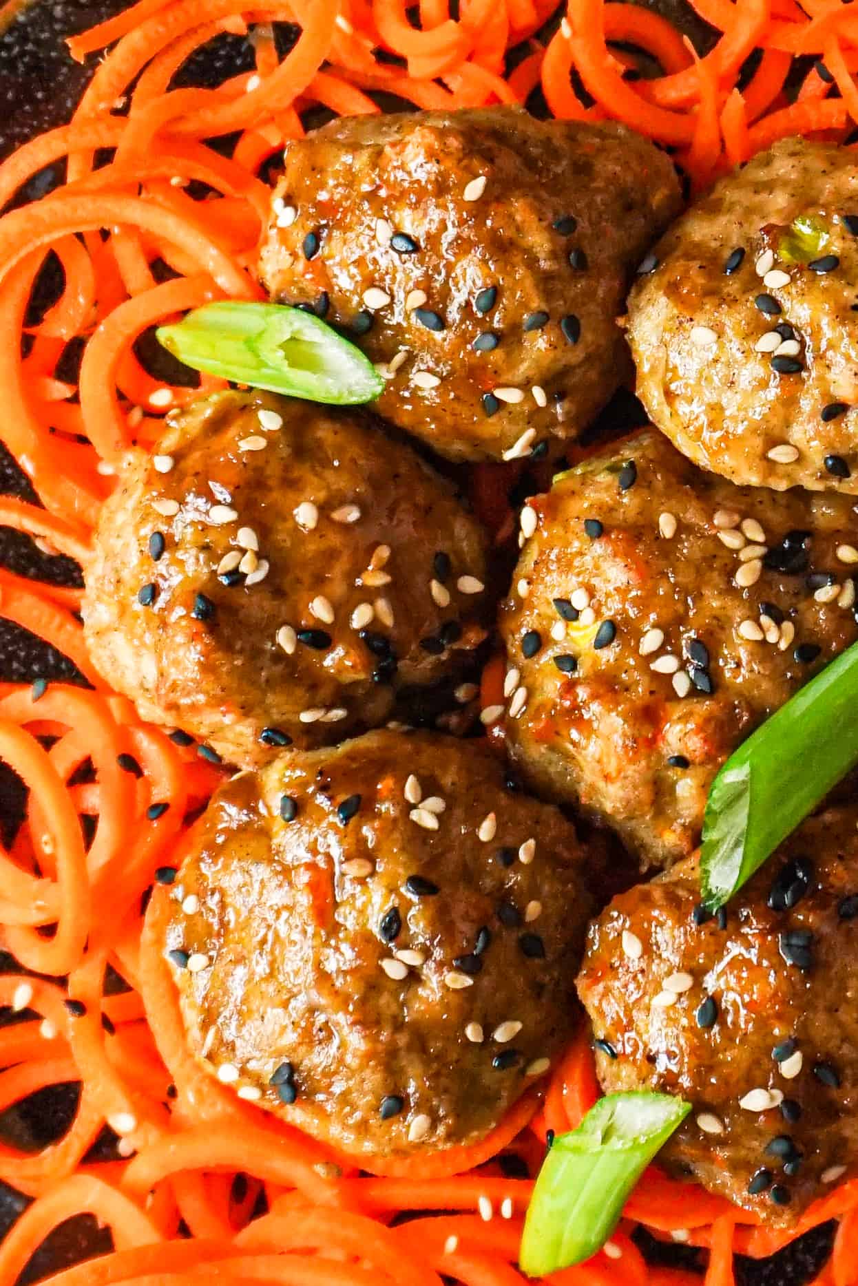 Chinese Chicken Meatballs ontop of spiralized carrots