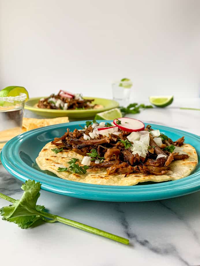 barbacoa, mexican shredded beef tacos with cilantro, and lime