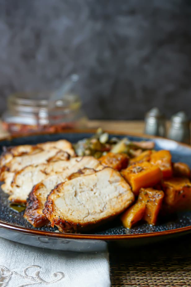 close up of butternut squash, collards, and pork tenderloin